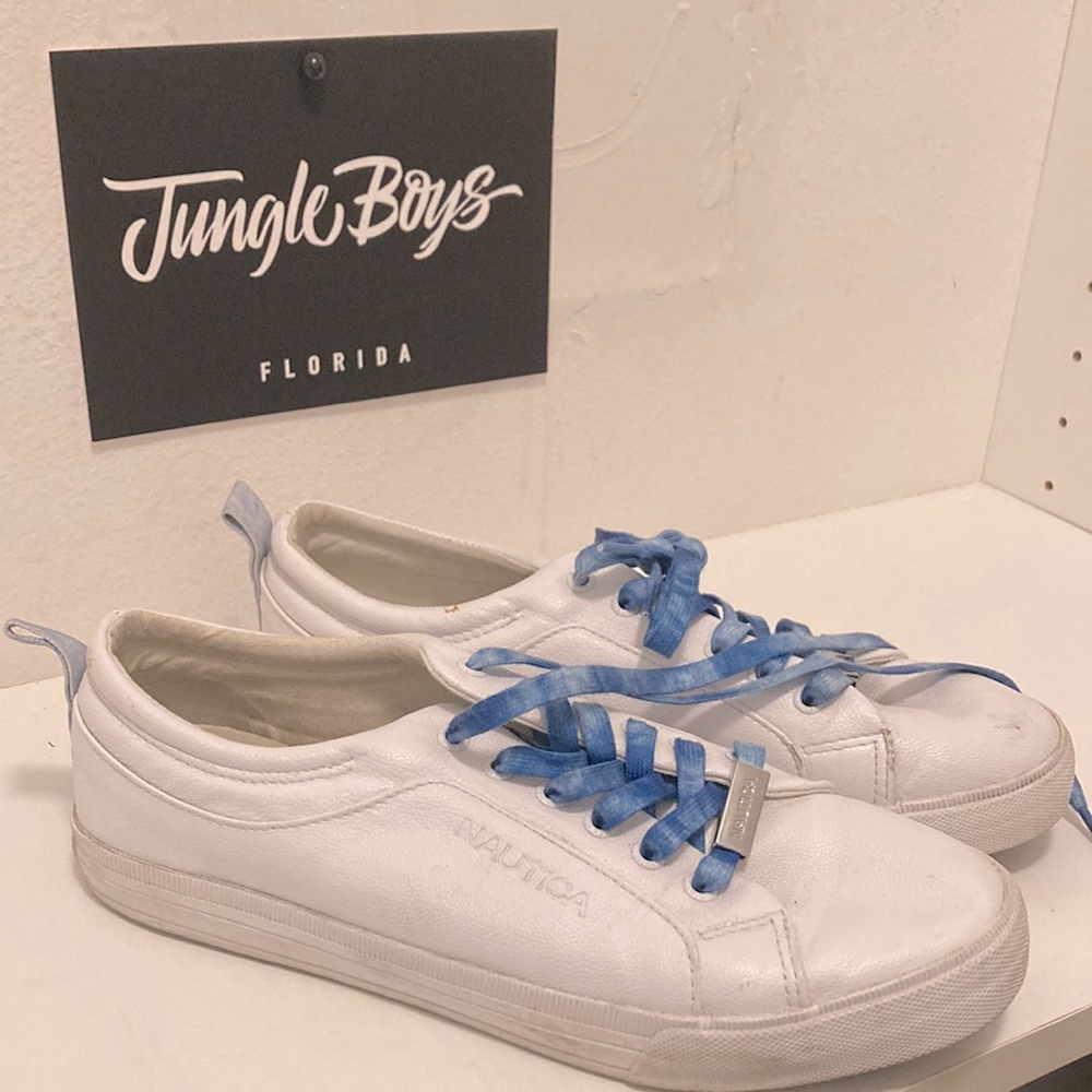 Size 9 slightly worn blue lace nautica brand white shoes.
